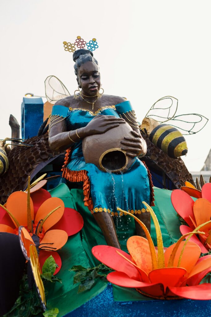 A statue of a woman seated on top of a carnival float in Calabar
