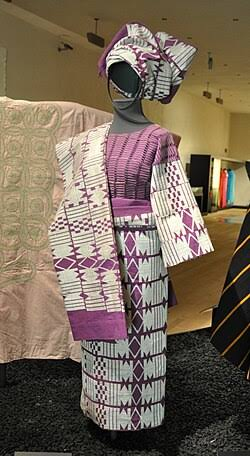 Young Nigerian wearing Aso Oke in a modern style