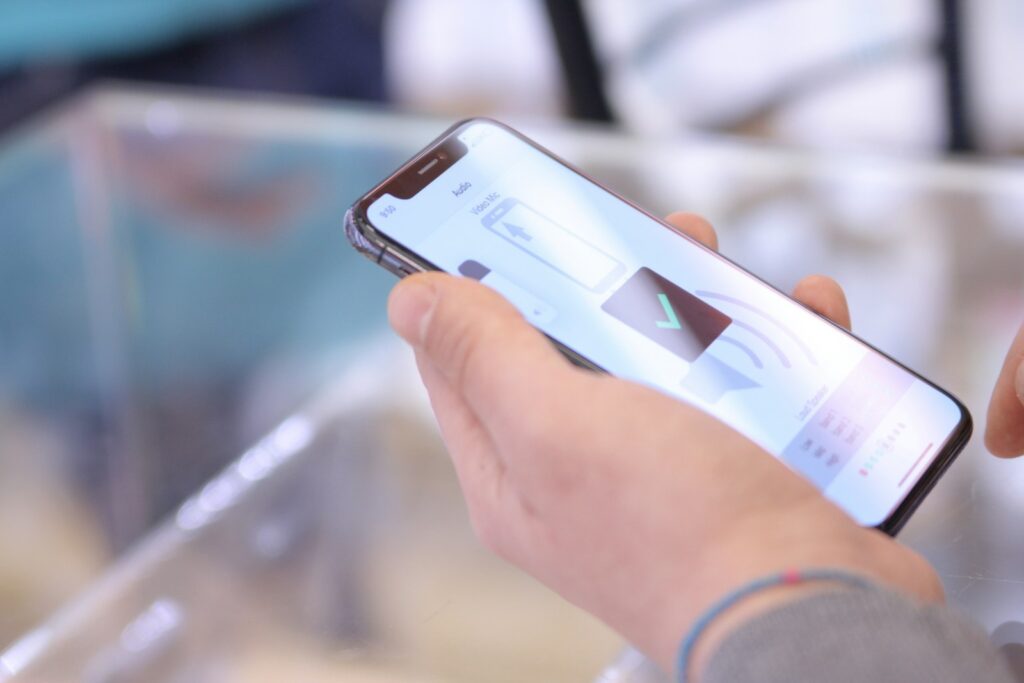 A person holding a smartphone in their hand