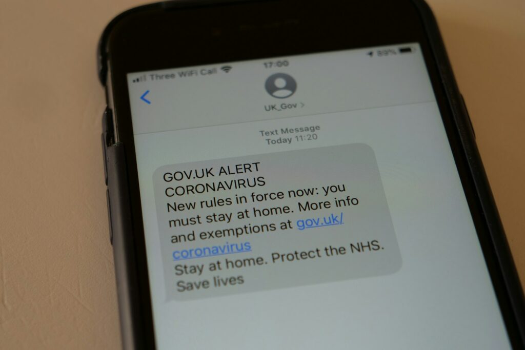 A mobile phone with a text message on the screen