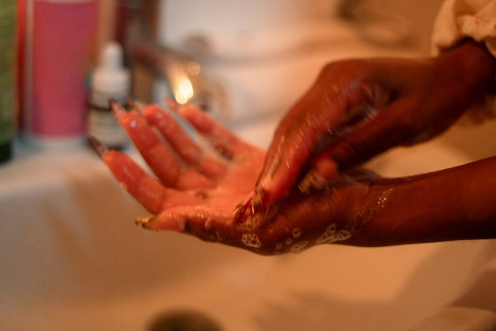 A person washing their hands with soap and water