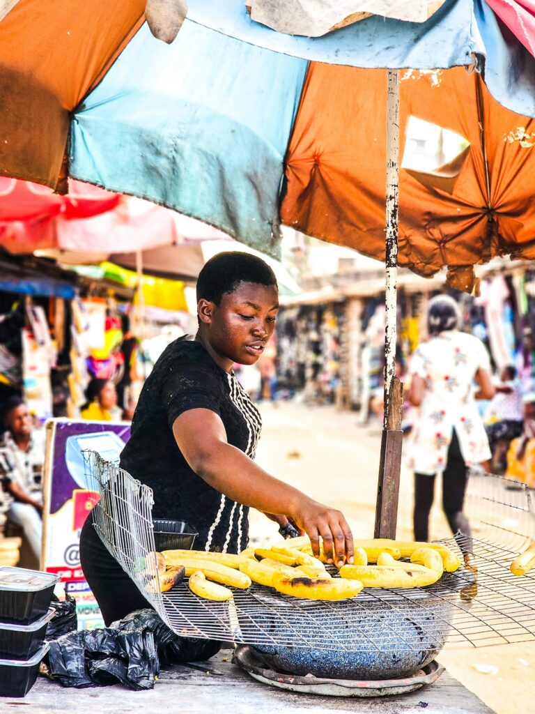 A woman selling bananas on the street